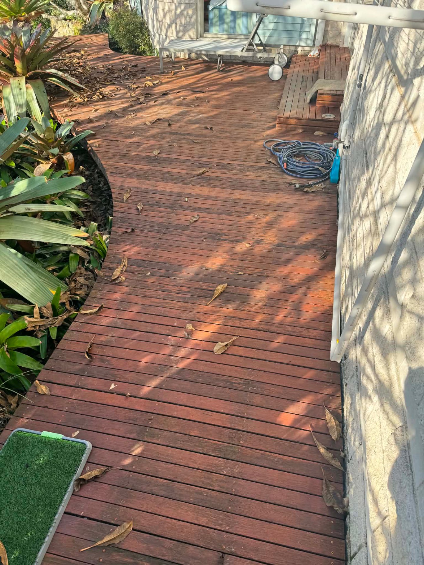 Weathered timber deck in Sydney before remedial restoration by Lacasa Building