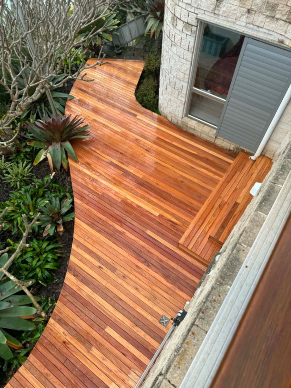 Newly restored timber deck and walkway wrapping a Sydney home